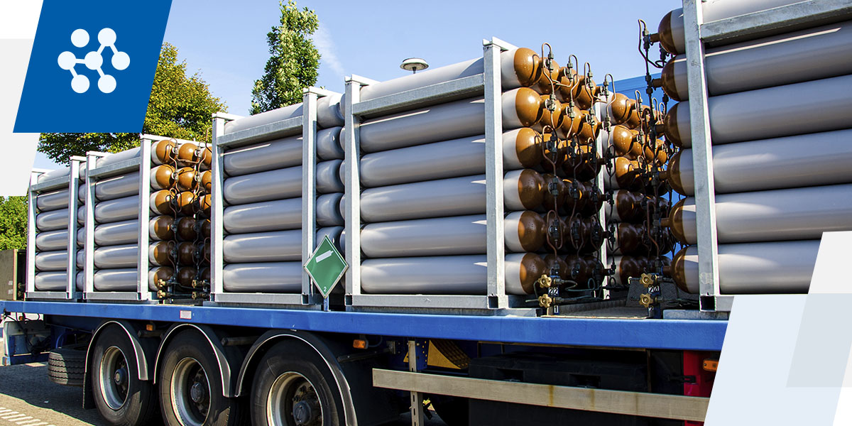 a blue truck with a lot of cylinders on it